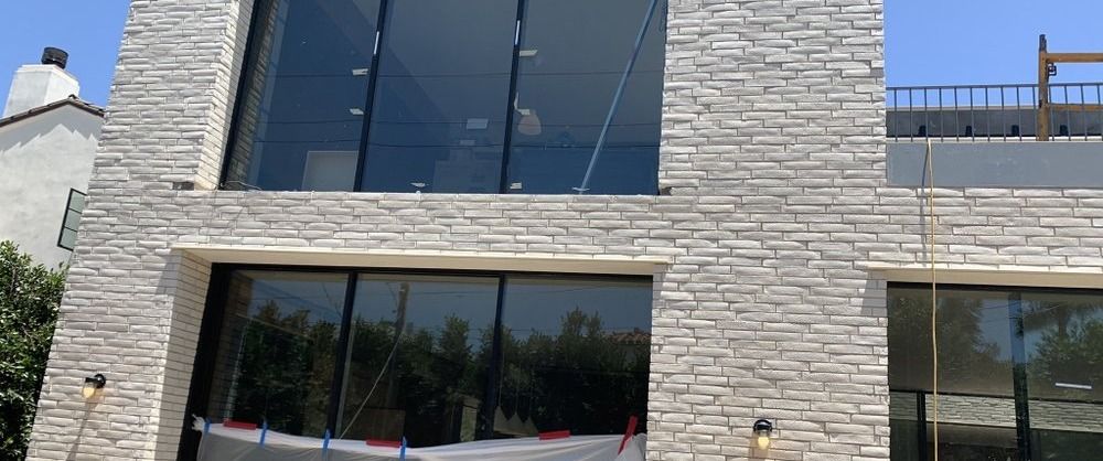 Santa Monica remodel — brick-and-glass street elevation, as built